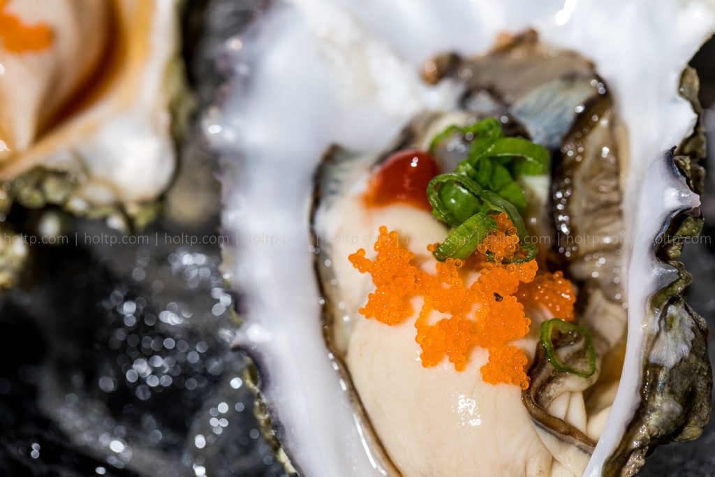 Oyster with Masago on Ice Appetizer Closeup Photo